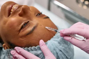 woman patient getting botox smiling happy