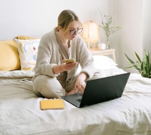 patient at home in bed with laptop computer awake