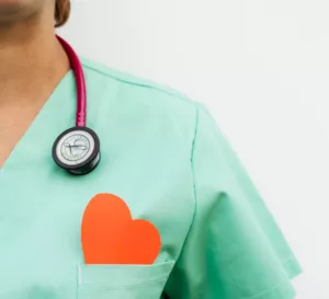 female healthcare worker with heart