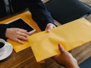 business people with manila envelope