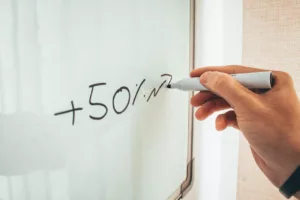 whiteboard with 50% increase