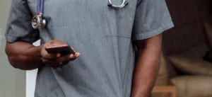 surgeon checking their digital surgical calendar on phone