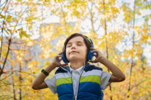 A kid listening to SurgiSnacks podcast